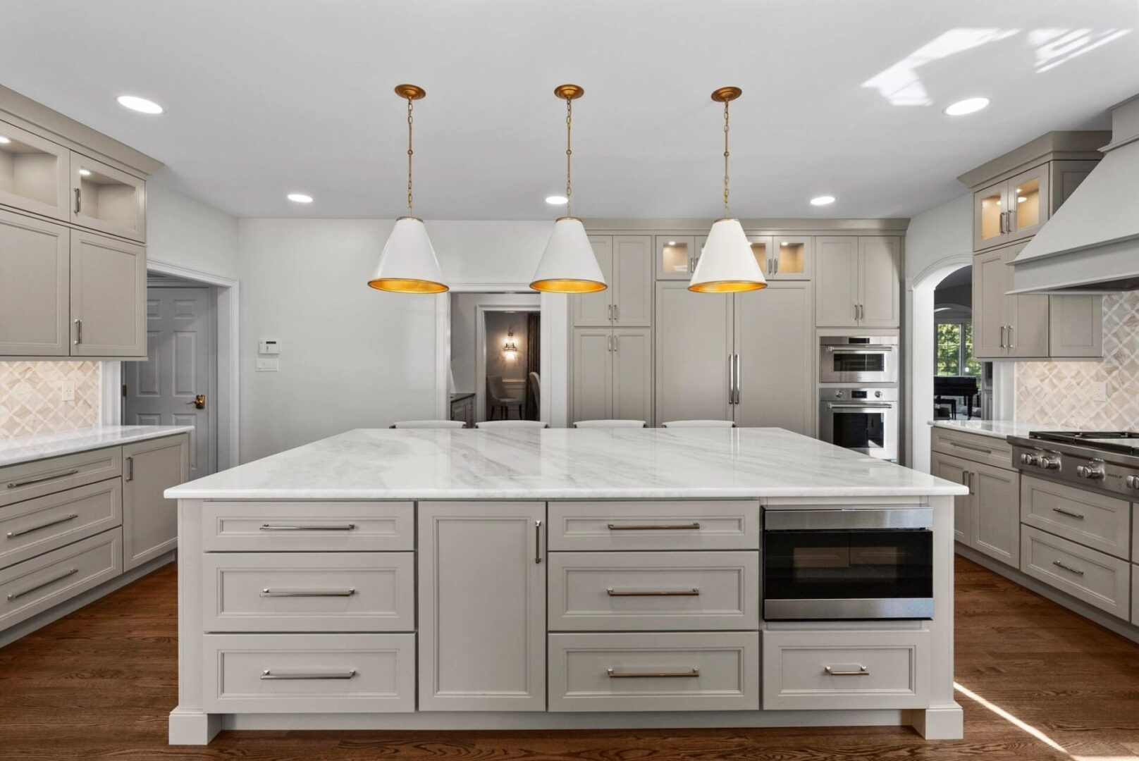 Modern kitchen with large marble island.