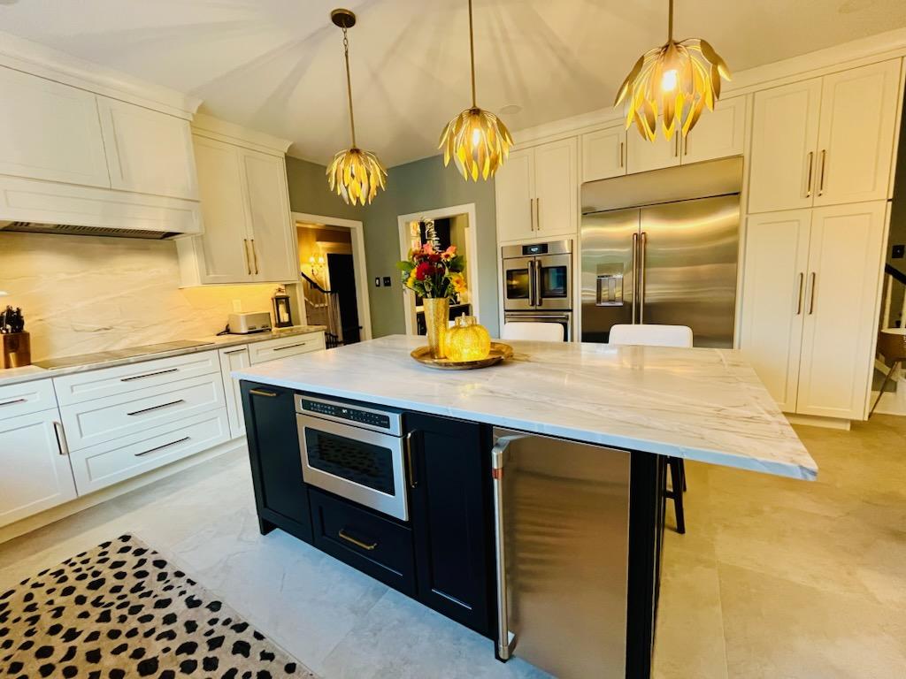 Luxury Kitchen featuring high end appliances and materials installed by Reaction Exteriors