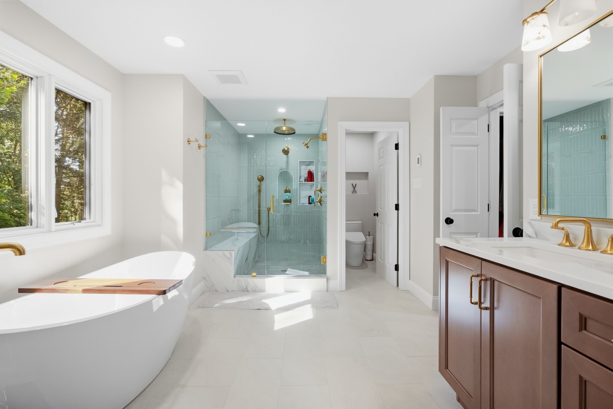 Master Bath installation by Reaction Exteriors in Chester County featuring soaking tub and steam shower.